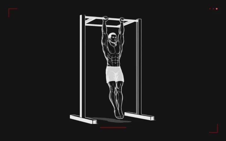 Dead hang : un homme suspendu bras tendus à une barre de traction, corps relâché et pieds décollés du sol