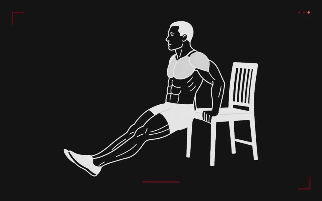 Dips sur chaise : un homme en appui sur les mains derrière lui, jambes tendues, qui descend en fléchissant les coudes
